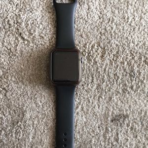Apple Watch series 1  with charger.